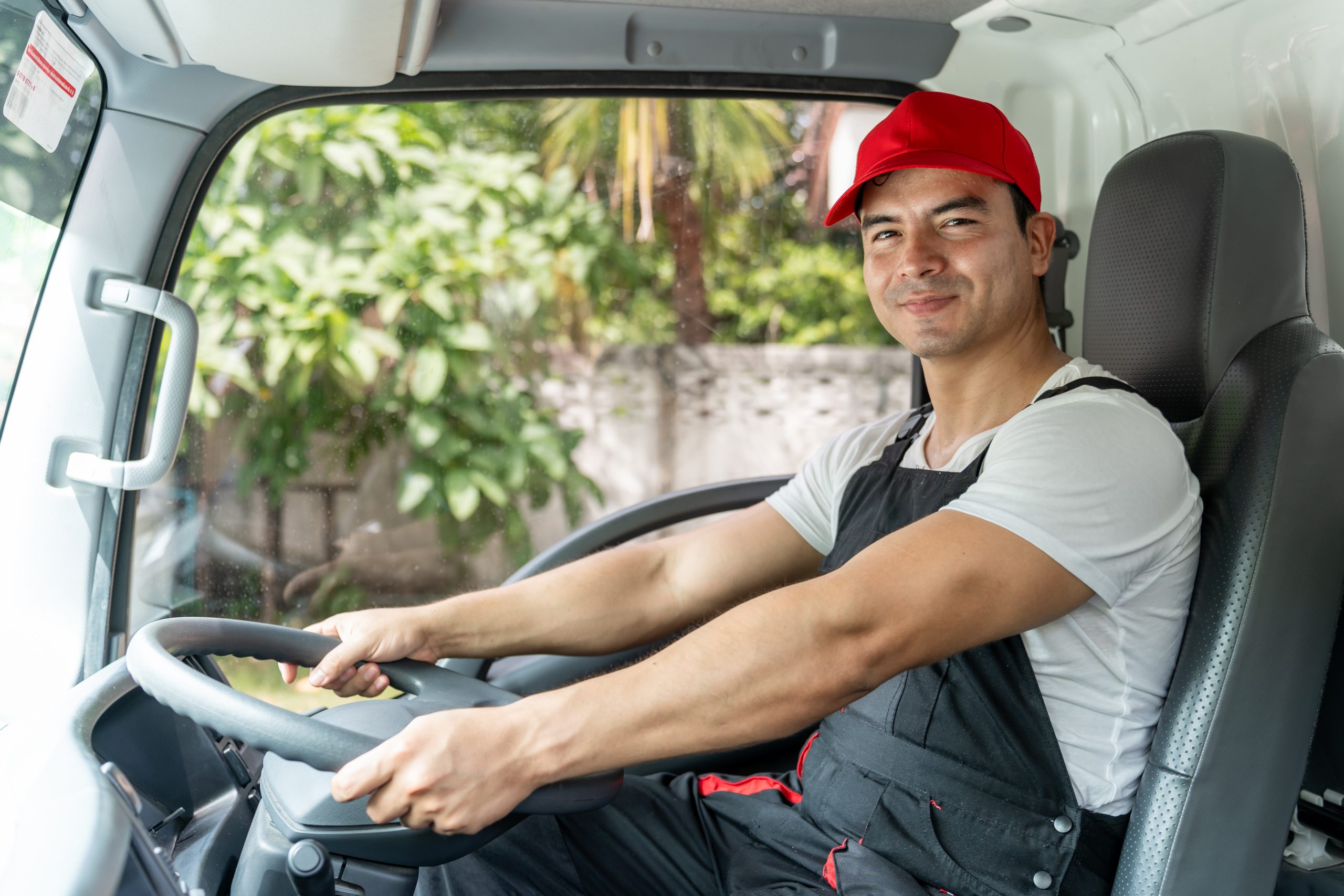 portrait-of-caucasian-delivery-man-delivering-pack-2025-03-25-16-51-40-utc