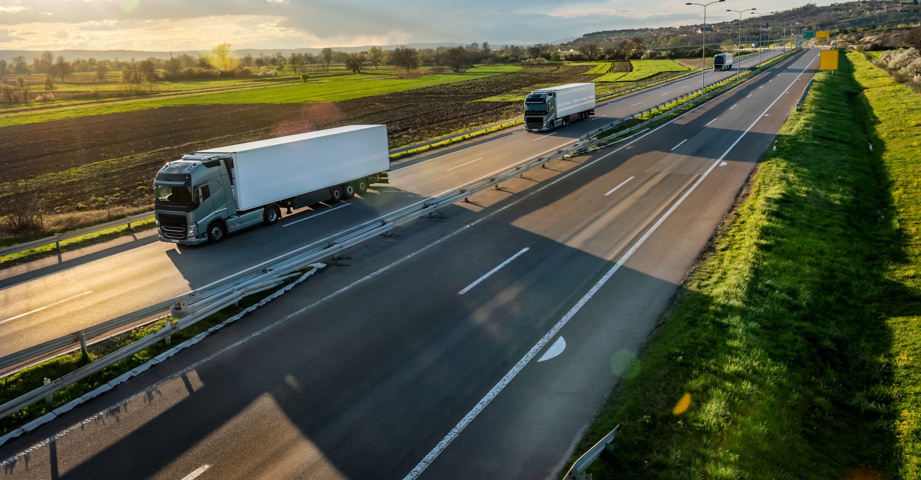 Convoy,Or,Fleet,Of,Transportation,Trucks,With,White,Trailers,On