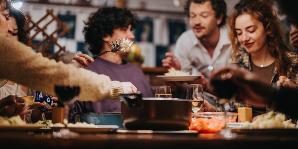 A,Warm,Scene,Of,Friends,Sharing,A,Meal,In,A