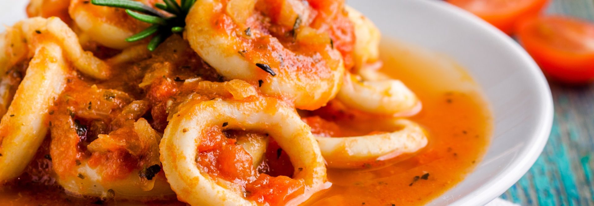 Stewed squid rings in tomato sauce for dinner