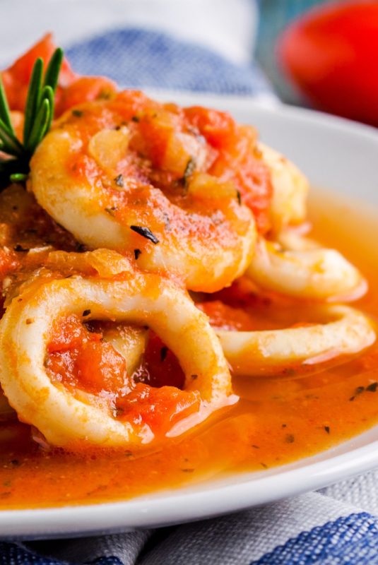 Stewed squid rings in tomato sauce for dinner