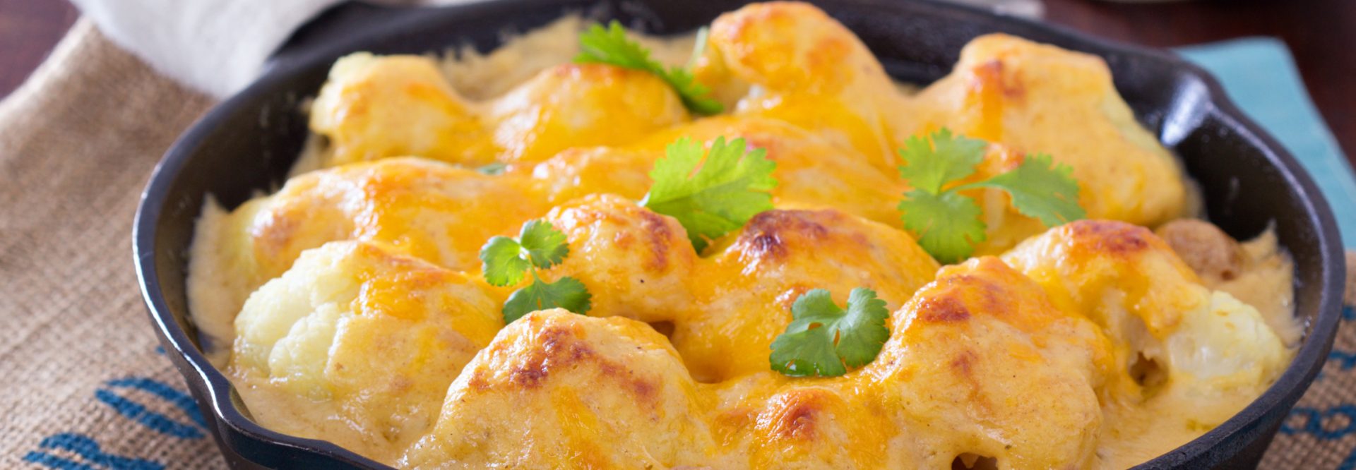 Cauliflower with cheese baked in cast iron pan