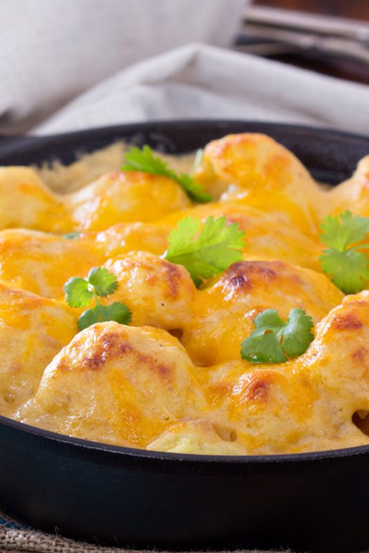Cauliflower with cheese baked in cast iron pan