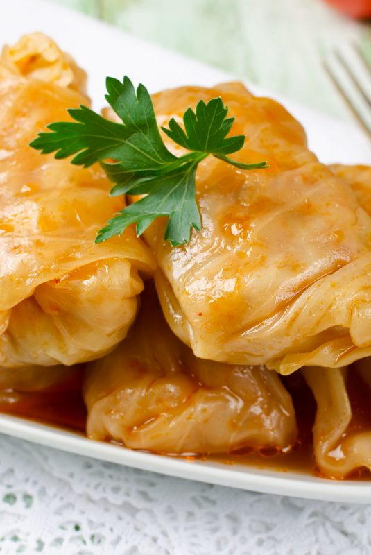 Stuffed cabbage rolls with rice and meat in tomato sauce