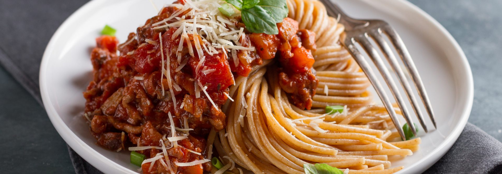 Wholegrain pasta spaghetti with vegetable sauce, selective focus