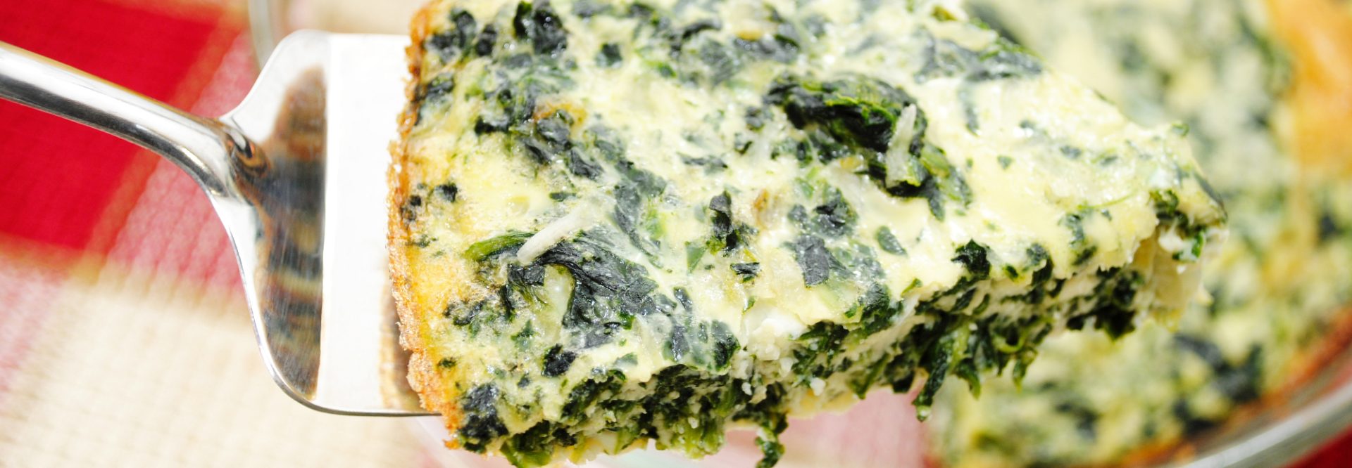 Close Up of a Serving of Spinach Quiche