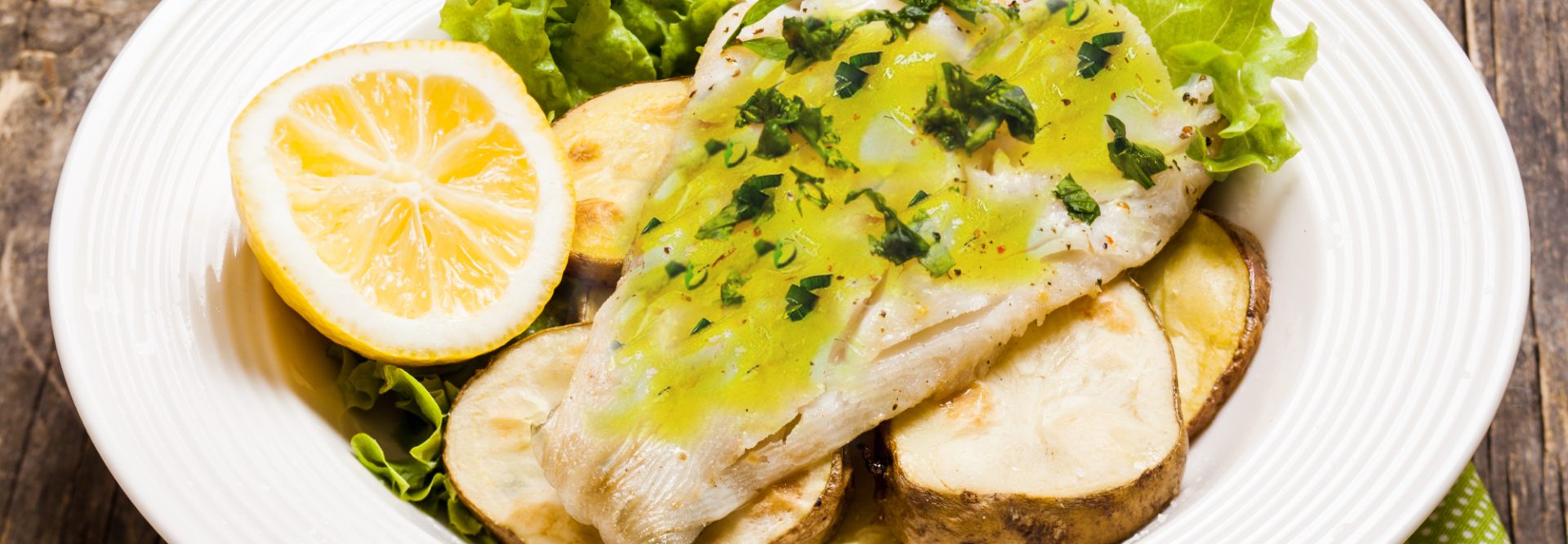 Baked cod fillet on rustic potato pillow