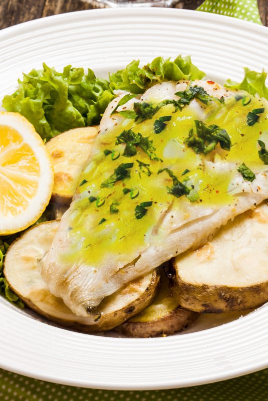 Baked cod fillet on rustic potato pillow